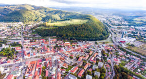 Aerial view of slovak town Banska Bystrica surrounded by hills.